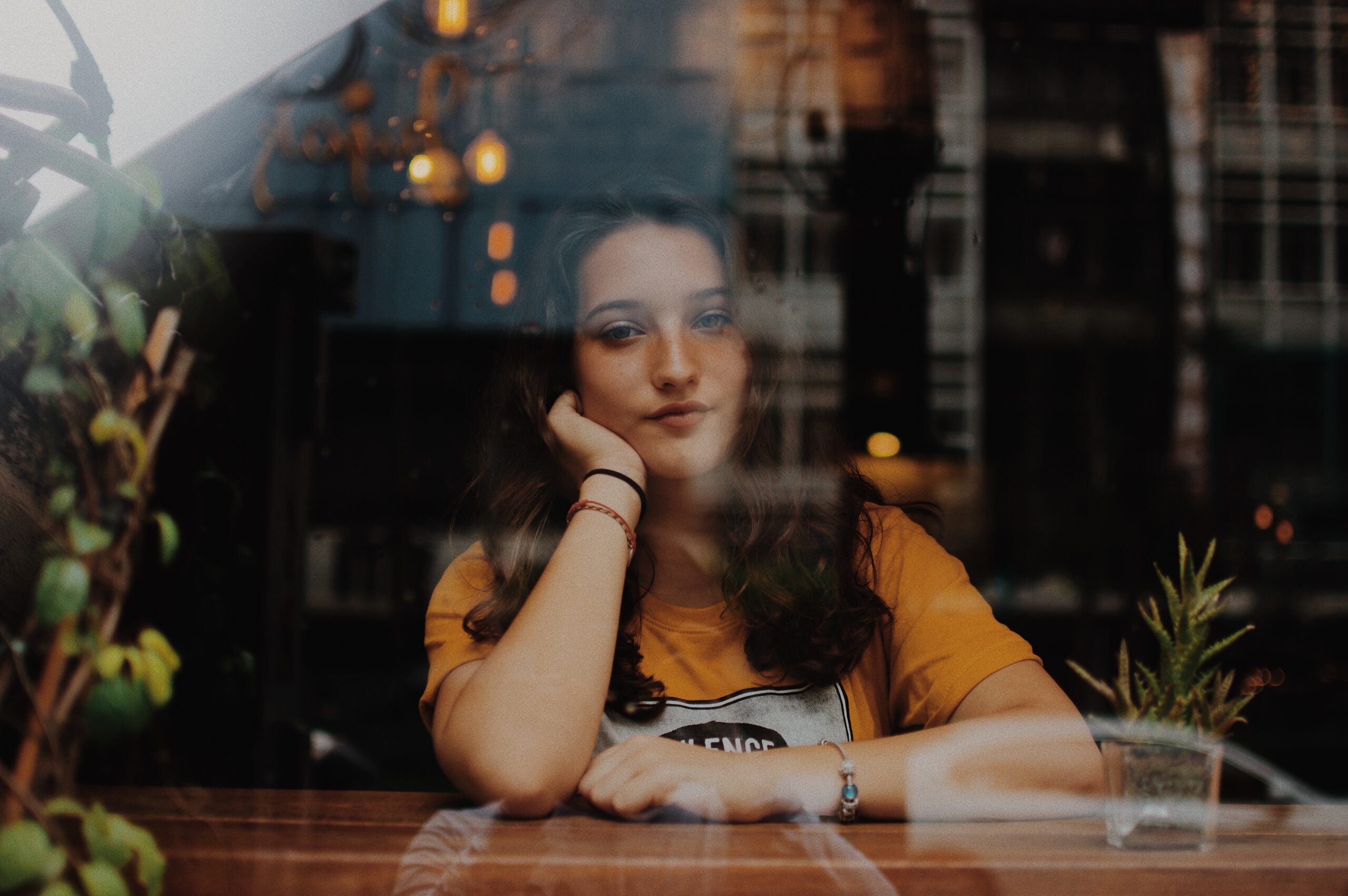 Photo of a girl in a window by Joshua Rawson Harris